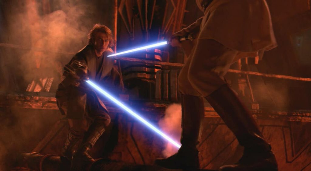 Anakin skywalker and obi-wan kenobi face off with their blue lightsabers on mustafar - top 25 best lightsaber battles in star wars!